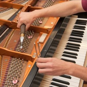 how often should a old piano be tuned
